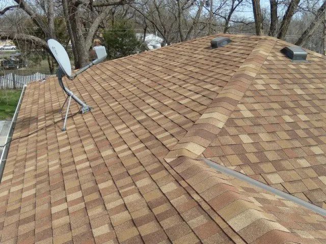 A roof with a satellite dish on top of it