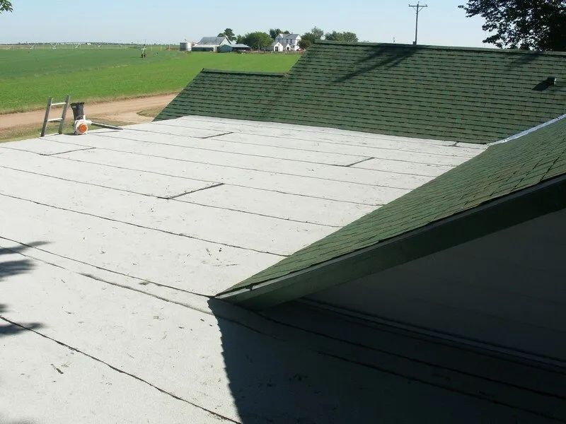 A roof with a green roof and a white roof