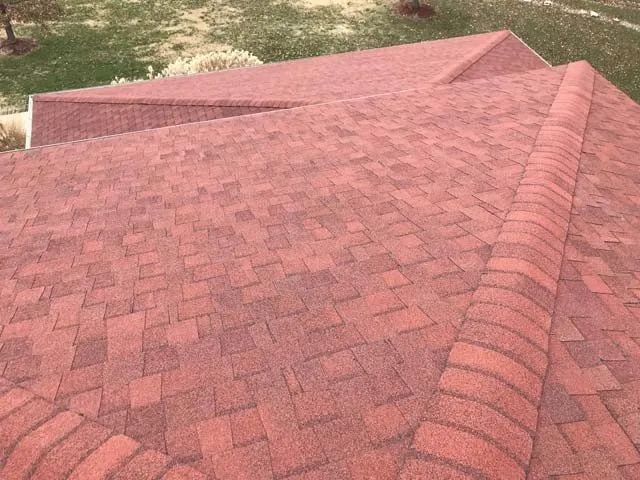 A close up of a red roof on a house