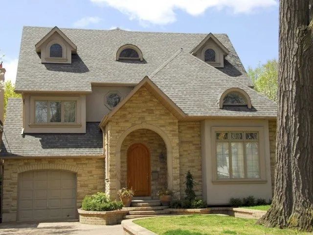 A large brick house with a gray roof