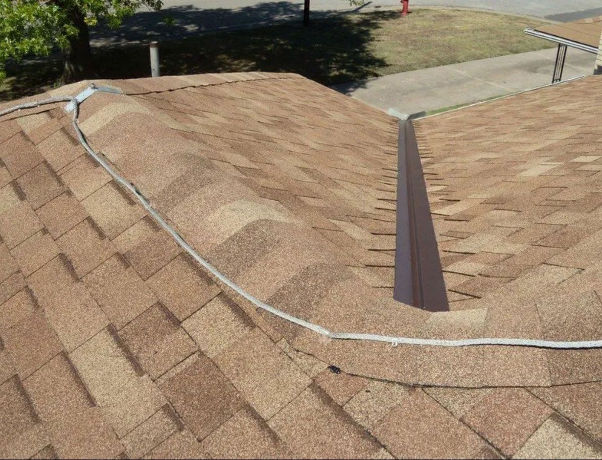 A close up of a roof with a drain on it