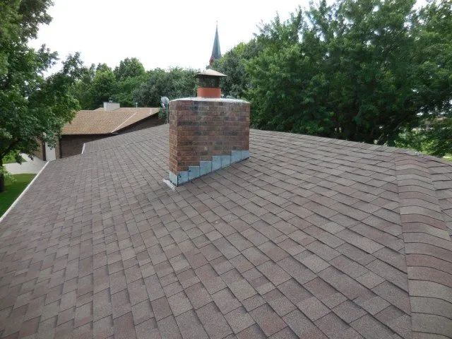A roof with a chimney on top of it