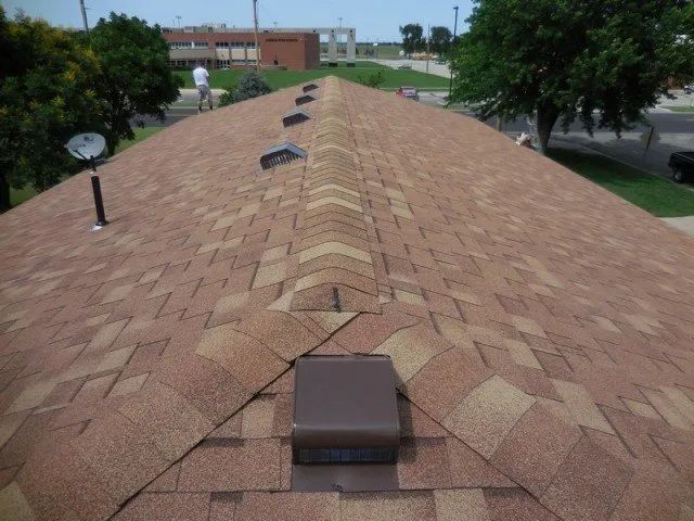 A roof with a satellite dish on top of it