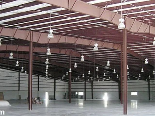 An empty warehouse with lots of lights