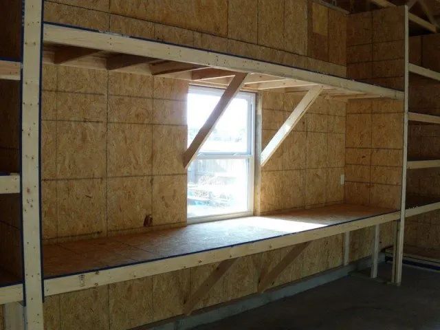 An empty room with bunk beds and a window