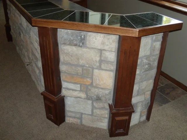 A stone wall with a wooden counter top