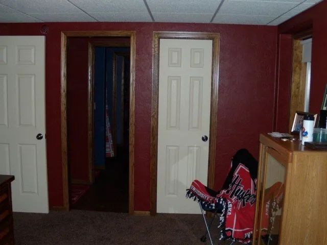 A room with red walls and white doors on it