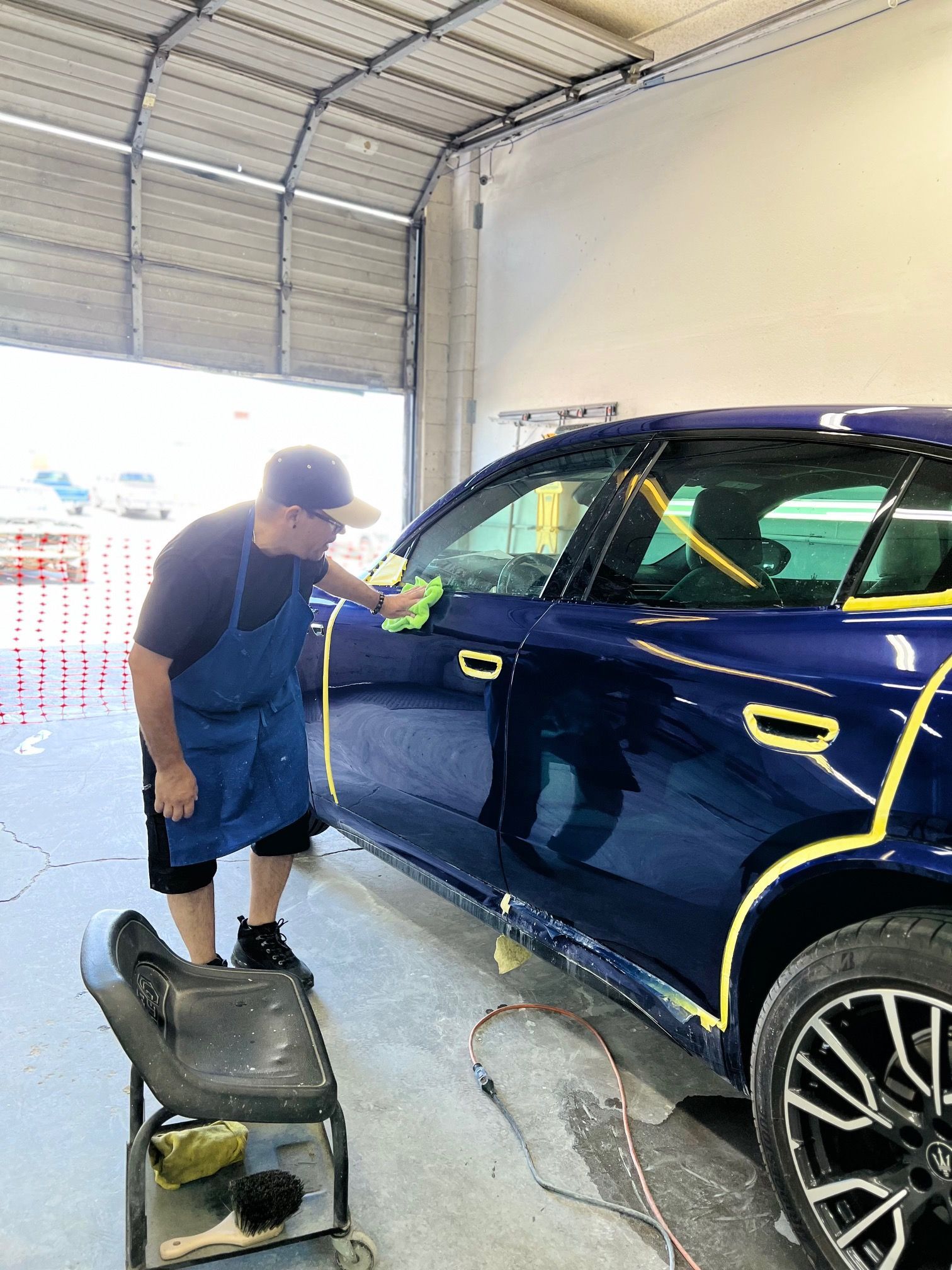 Man repairing car's bumper