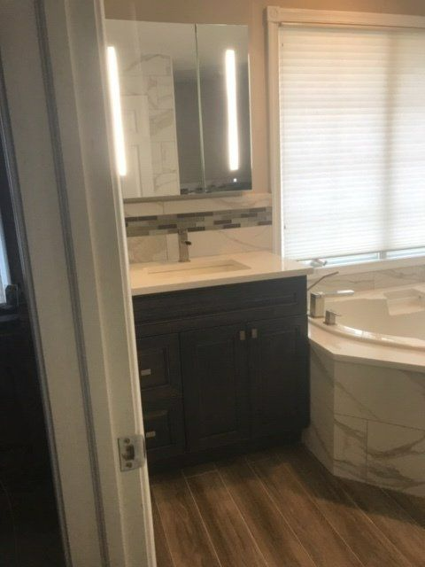 Bathroom cabinet and bath tub