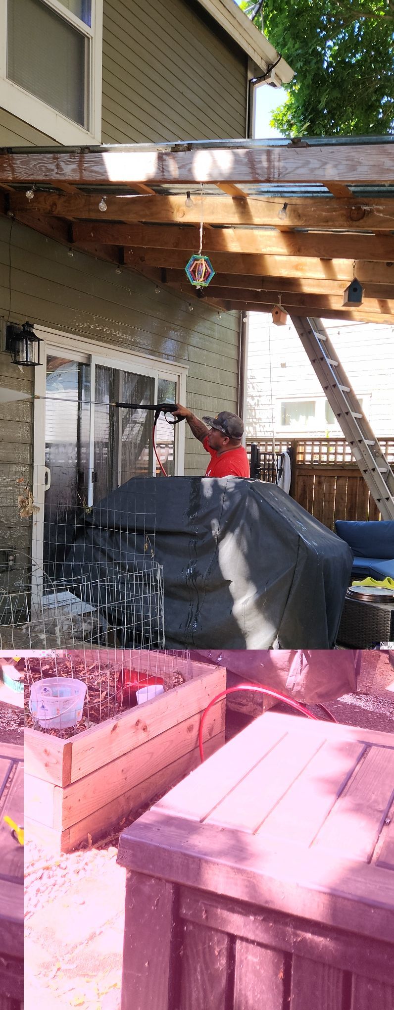 Partially built deck with exposed beams, a red power tool, and pink lumber in the foreground