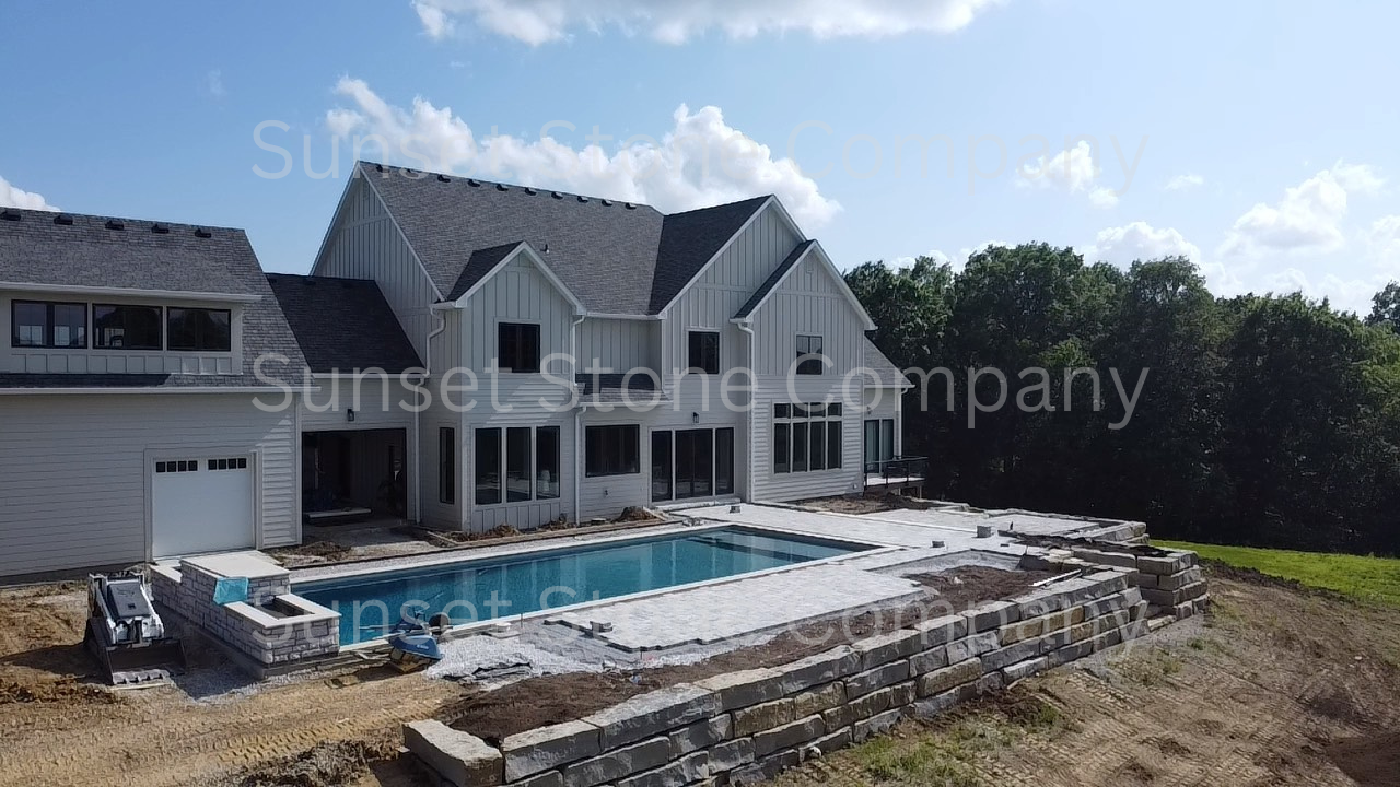 back yard with pool stone around pool
