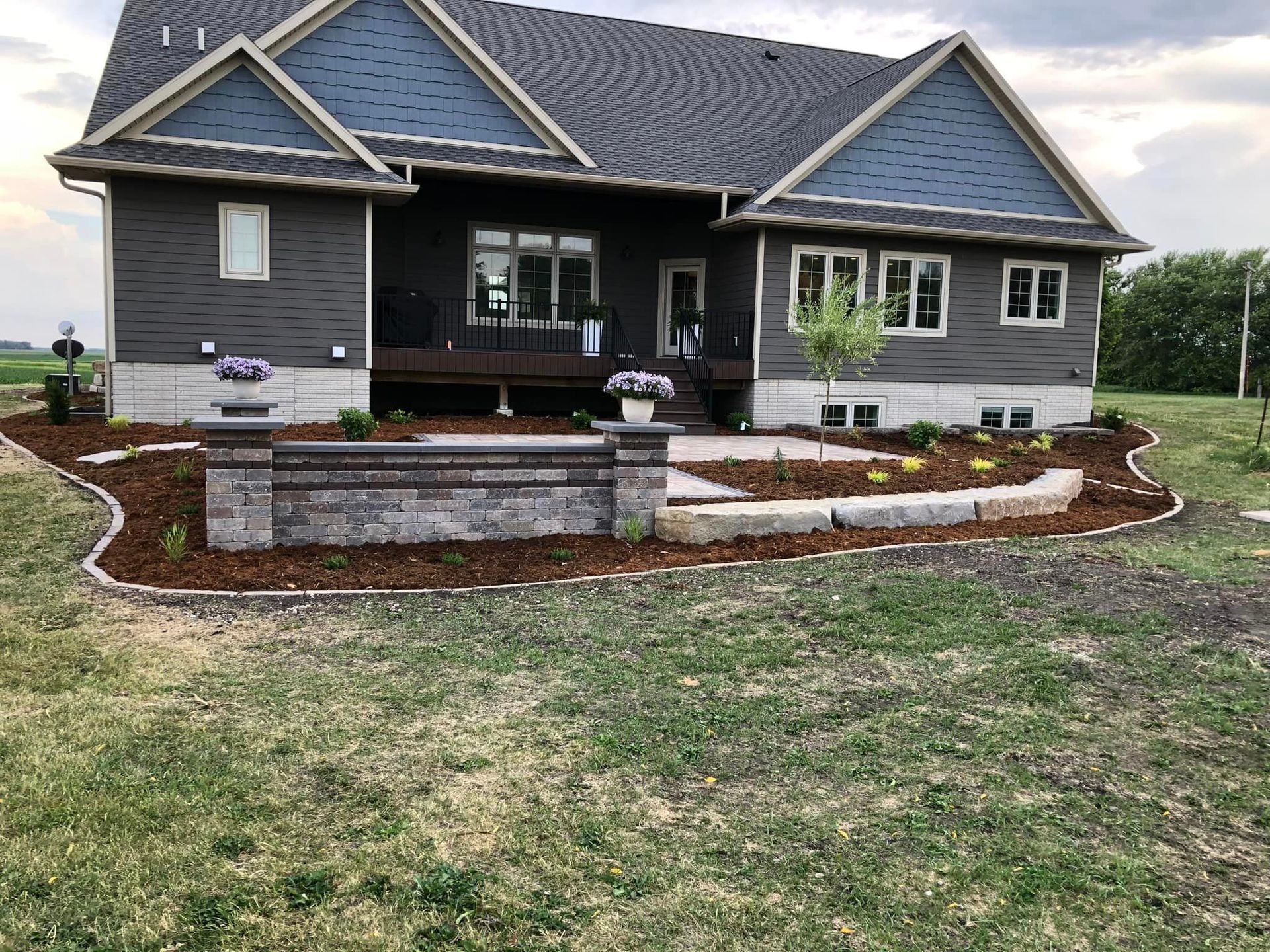 A large house with a large lawn in front of it.