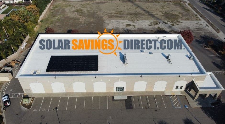 An aerial view of a building that says solar savings direct.com