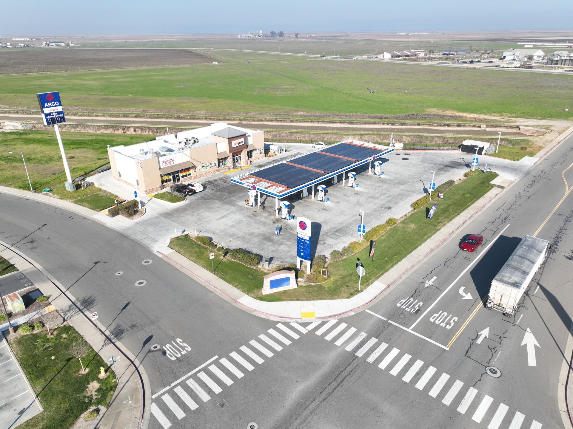 An aerial view of a gas station with a pepsi sign