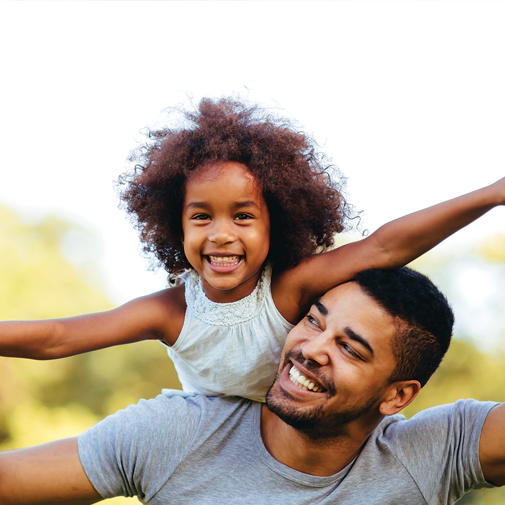 father and daughter smiling