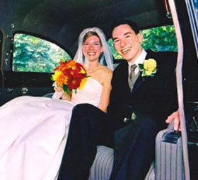 bride and groom in a limousine