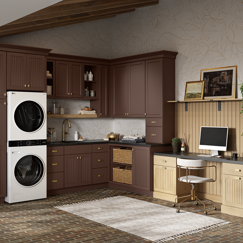 Laundry room with brown cabinets, stacked washer/dryer, desk, and rug.
