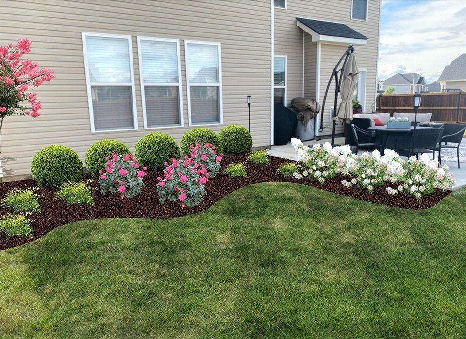Backyard landscaping with green lawn, flower beds, and house.