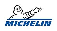 Michelin Man, a tire-shaped mascot, points upward.