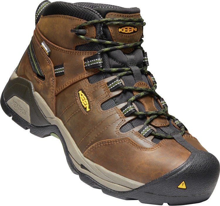 A pair of brown keen boots on a white background