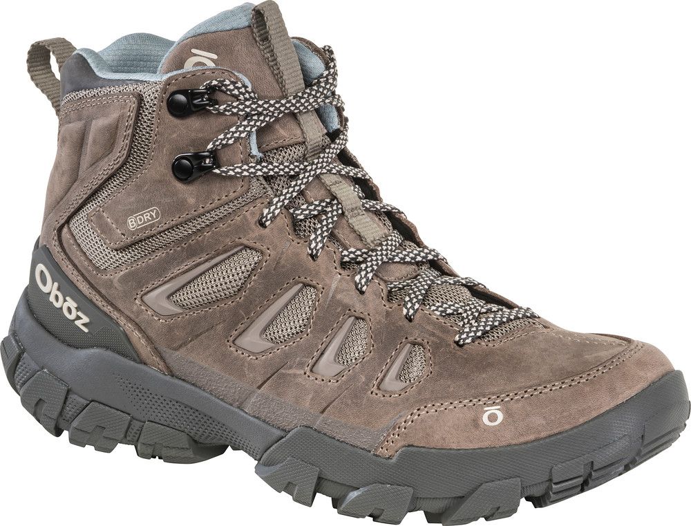A pair of ooboz hiking boots on a white background