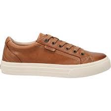 A pair of brown leather sneakers with a white sole on a white background.