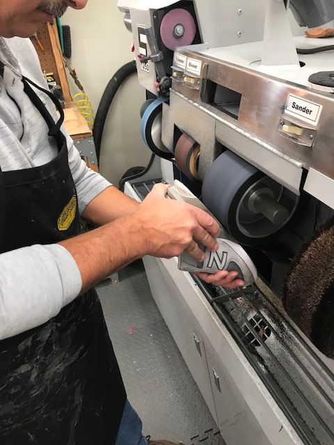 man making custom shoes