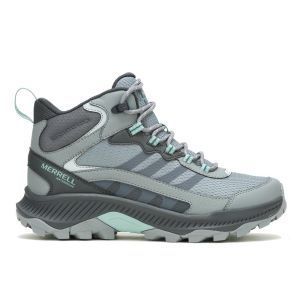 A pair of gray merrell hiking boots on a white background.