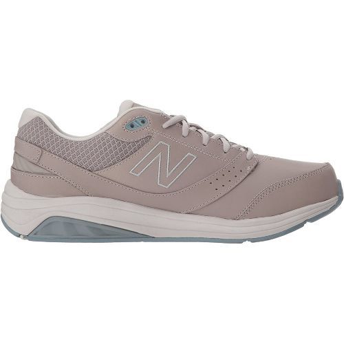 A pair of new balance shoes on a white background.