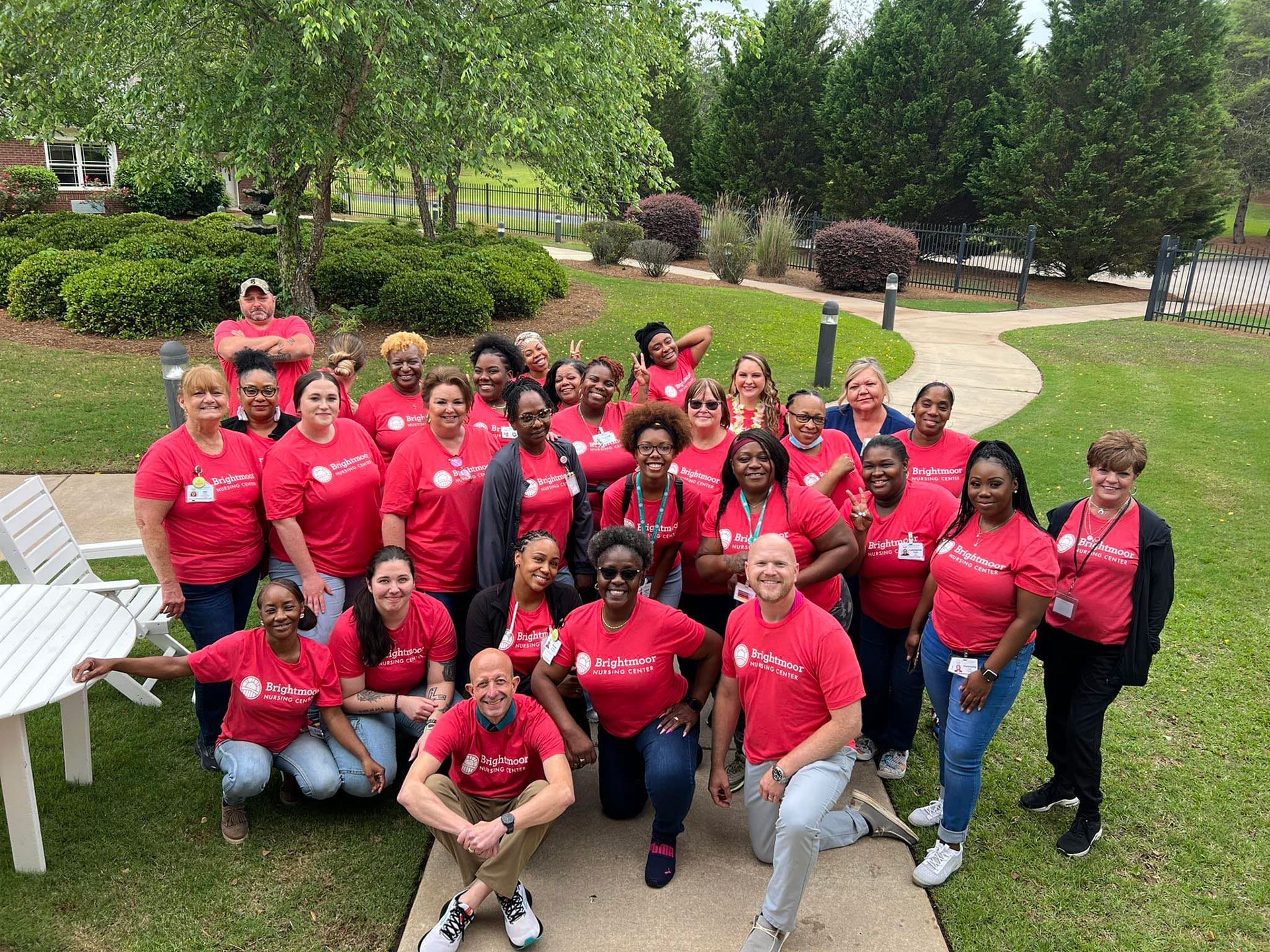 group of nurses on red shirt