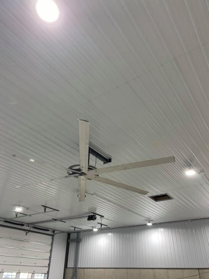 A ceiling fan is hanging from the ceiling of a building.