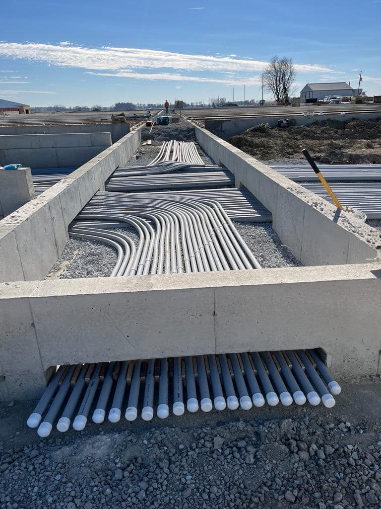 A concrete structure with a lot of wires coming out of it.