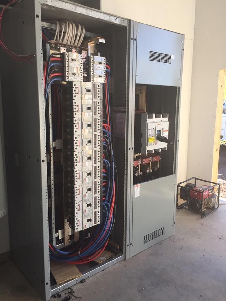 A large electrical box with a lot of wires coming out of it.