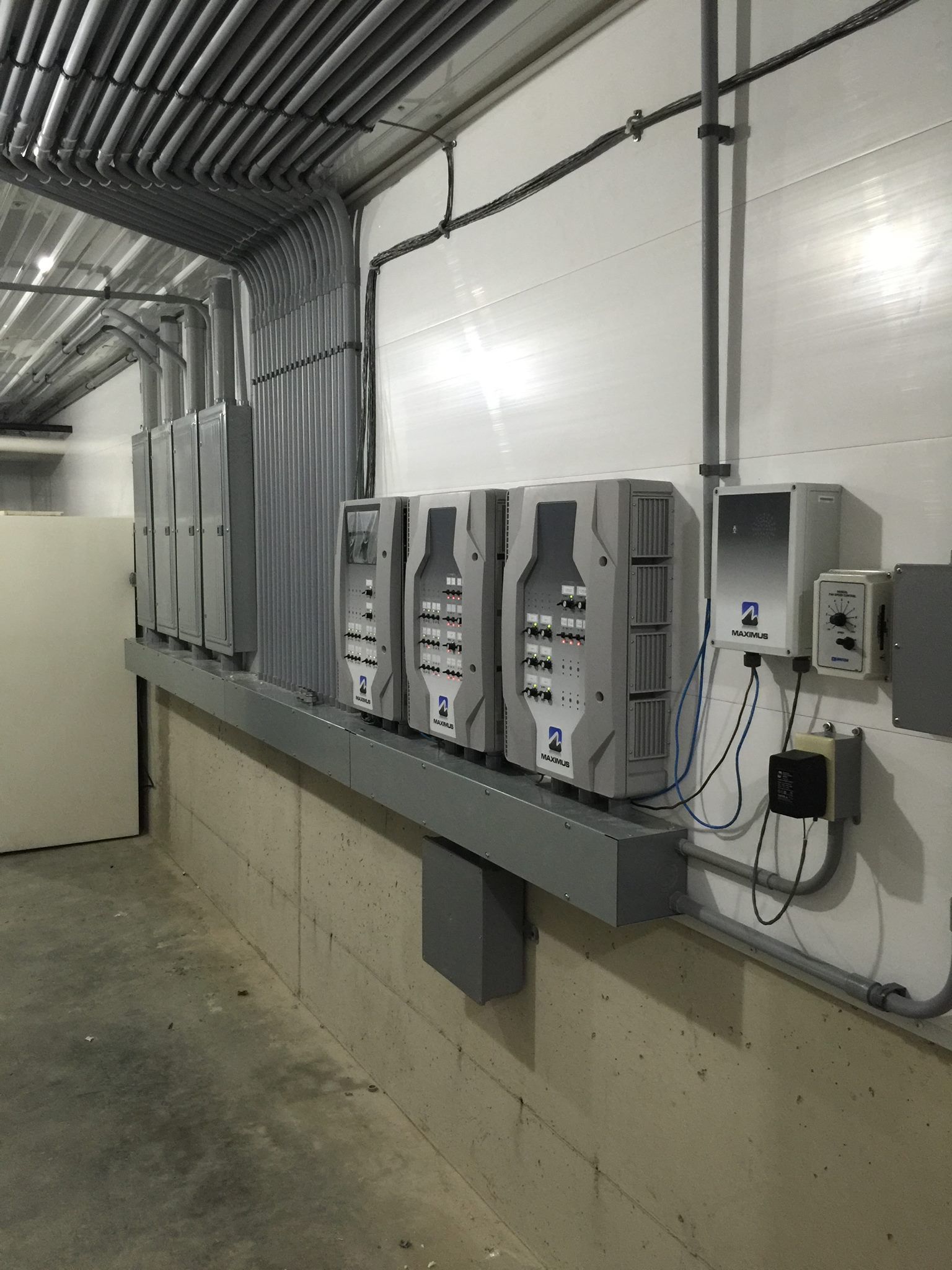 A room with a lot of electrical boxes on the wall.