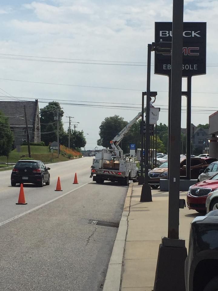 Electrical expert repairing electrical post.