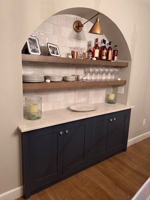 Built-in cabinet with arched shelves