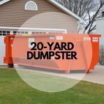 A 20 yard dumpster is parked in front of a house.