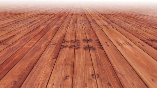A wooden floor with the sun shining through it