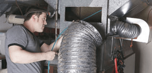 Man fixing a duct