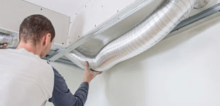 Man holding a duct