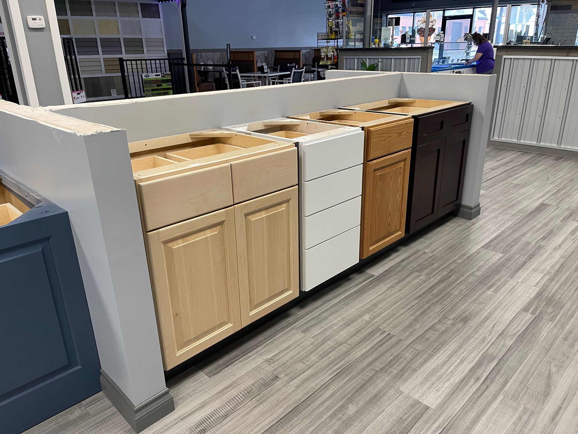 Kitchen cabinet displays in various colors.