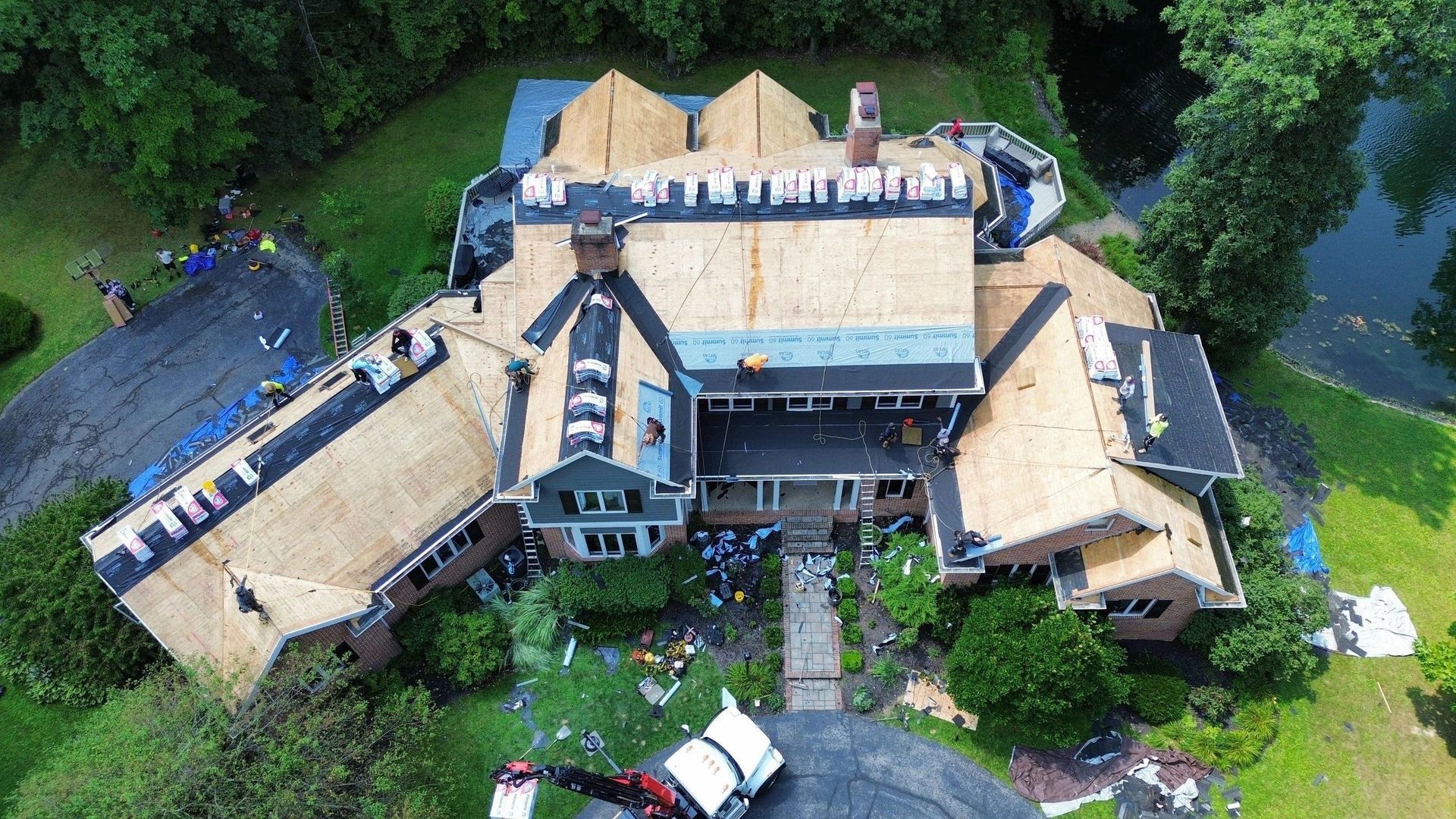 An aerial view of a large house under construction.