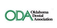 Oklahoma Dental Association logo with green ODA letters and black text on white background