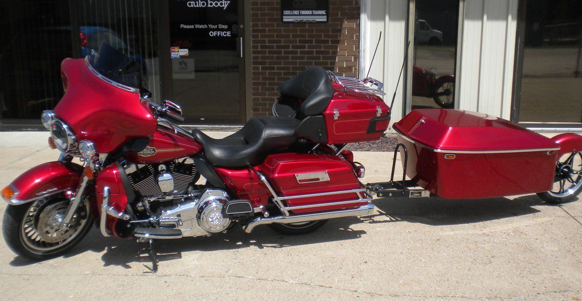 One wheel ruby red motorcycle trailer