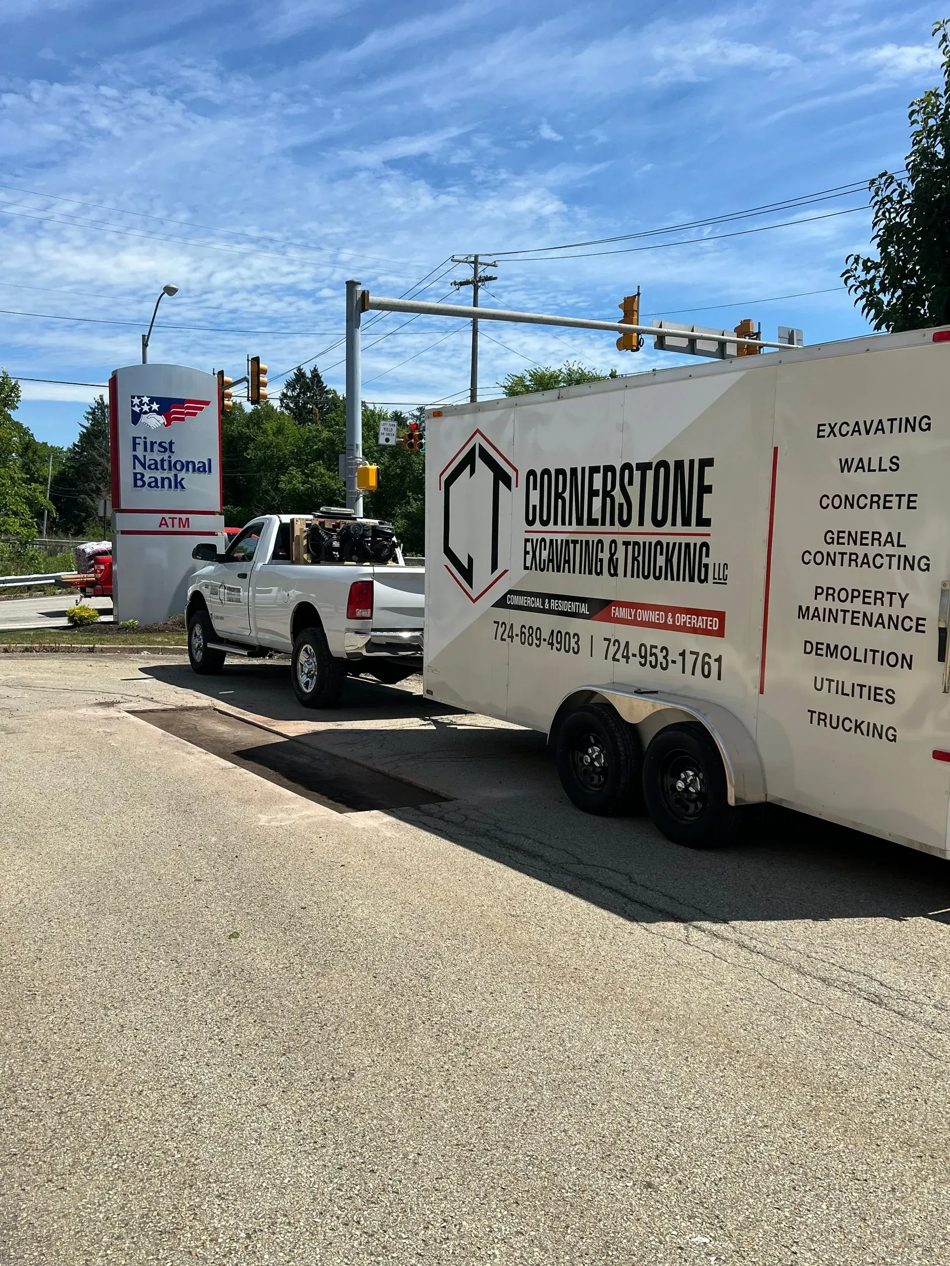 White truck towing trailer for 