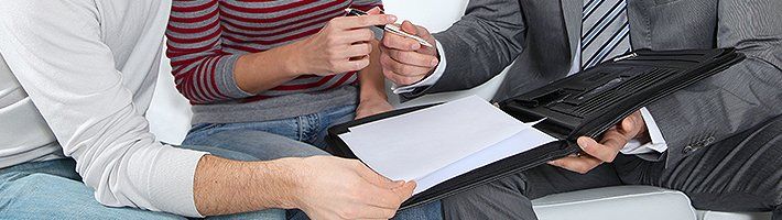 Couple about to sign a document