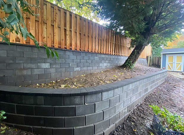 Retaining wall and a wooden fence