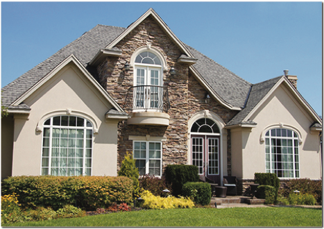A large house with a lot of windows and a balcony