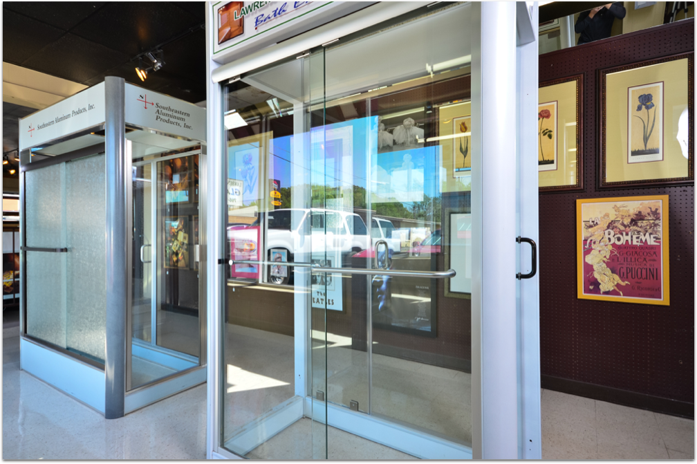 A picture of a glass door and a picture of a picture on a wall.