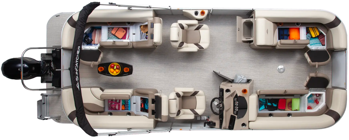 An overhead view of a pontoon boat deck with cream-colored seating, a helm station, a table, and a rear-mounted motor.